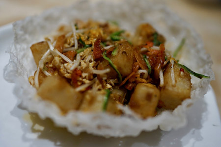 Wok fried radish cake with bean sprouts